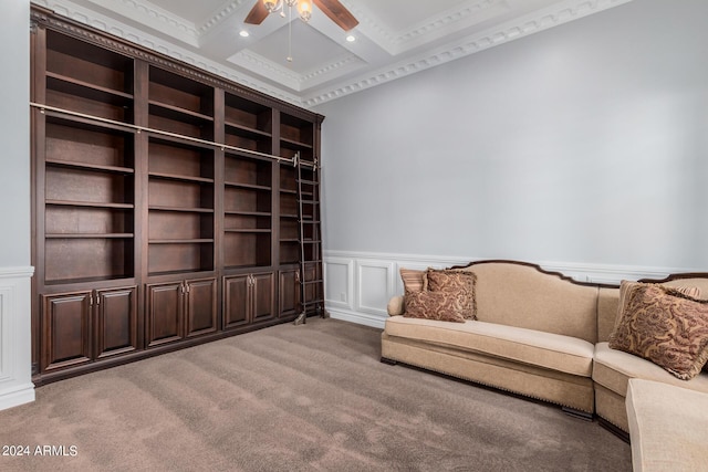 living area featuring ceiling fan, coffered ceiling, beamed ceiling, crown molding, and light colored carpet