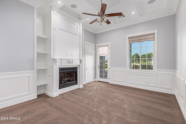 unfurnished living room with carpet, built in features, ceiling fan, and coffered ceiling