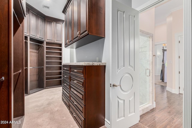 spacious closet with light wood-type flooring