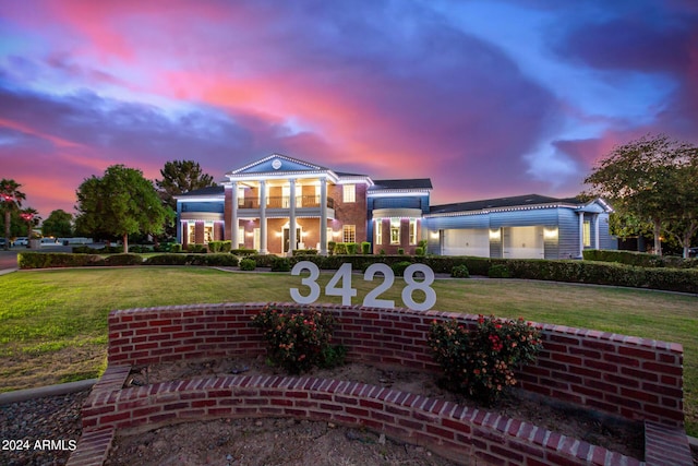 view of front of property with a lawn