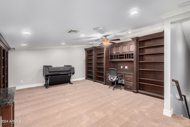 carpeted home office with ceiling fan and crown molding