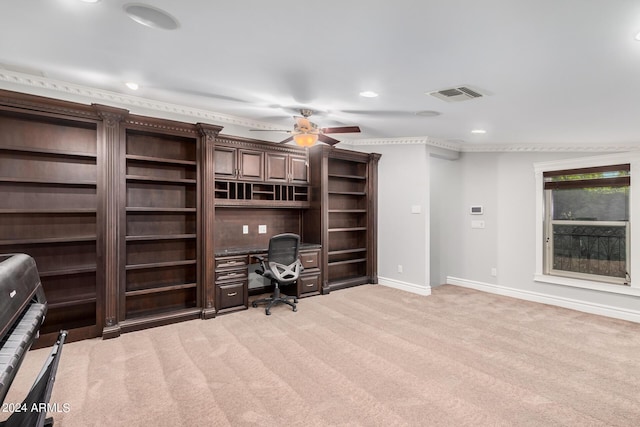 unfurnished office featuring ceiling fan and light colored carpet