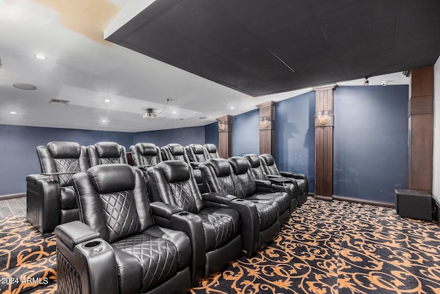 carpeted home theater with ornate columns