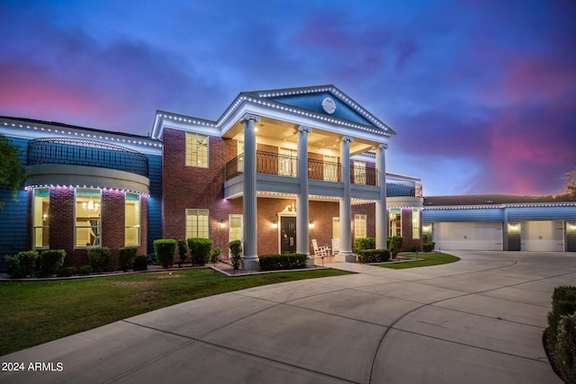 neoclassical home featuring a balcony and ceiling fan