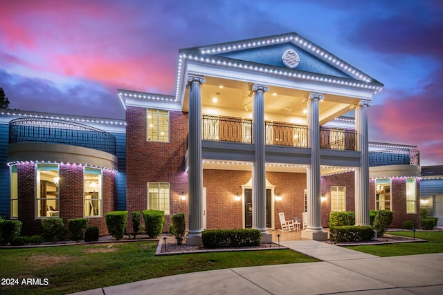 greek revival house with a balcony