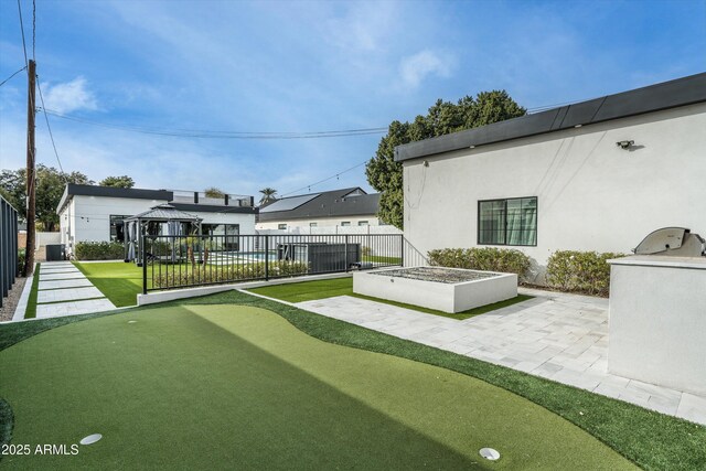 view of yard with a fenced backyard, a patio, and a gazebo