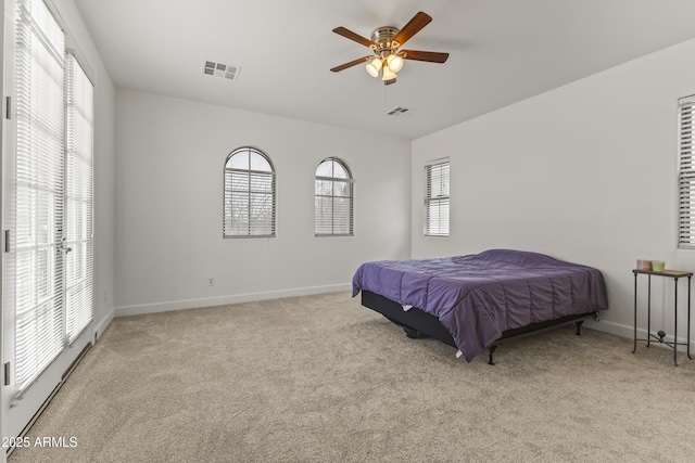 bedroom with a ceiling fan, carpet, visible vents, and baseboards