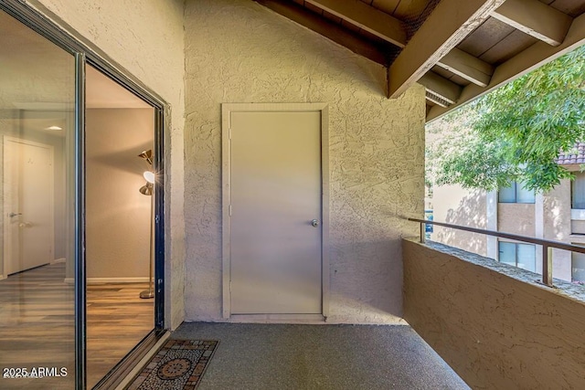 entrance to property featuring a balcony