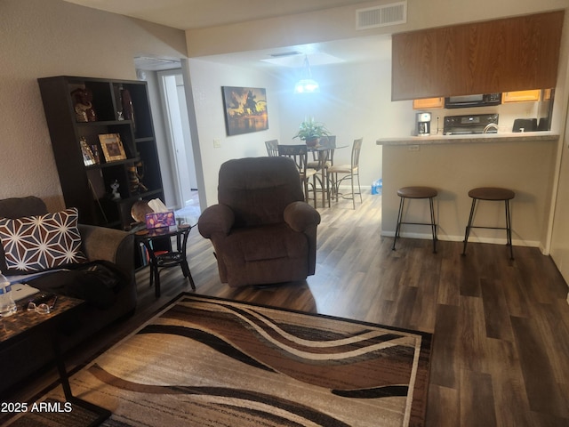 living room featuring dark hardwood / wood-style flooring