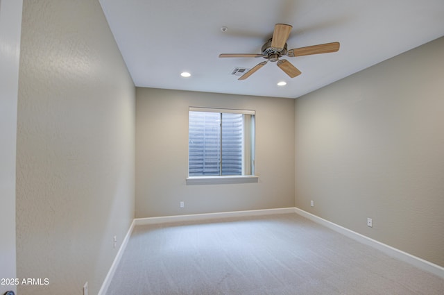 spare room featuring ceiling fan, recessed lighting, carpet floors, visible vents, and baseboards