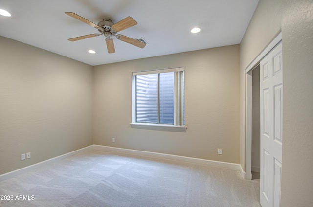 unfurnished bedroom featuring carpet, baseboards, ceiling fan, and recessed lighting