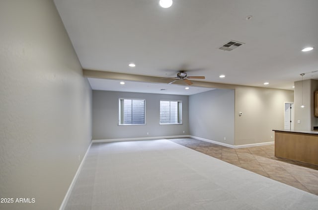 spare room featuring recessed lighting, visible vents, light carpet, and baseboards