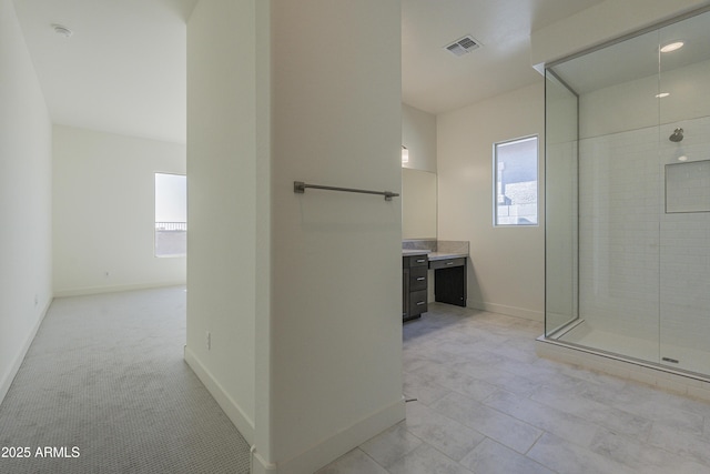 16367 W Desert Mirage Dr, Surprise, AZ 85388 - full bathroom featuring a tile shower, baseboards, vanity, and visible vents