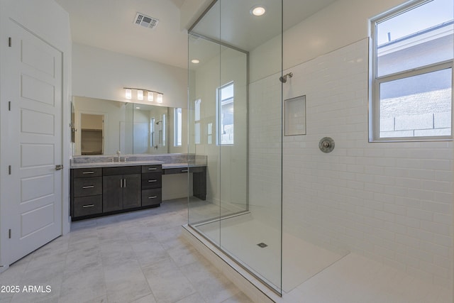 16367 W Desert Mirage Dr, Surprise, AZ 85388 - bathroom featuring recessed lighting, visible vents, vanity, and a walk in shower