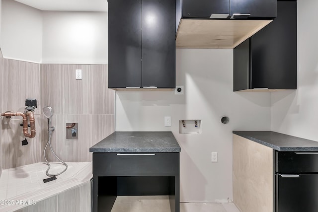 kitchen with dark countertops, modern cabinets, and dark cabinets