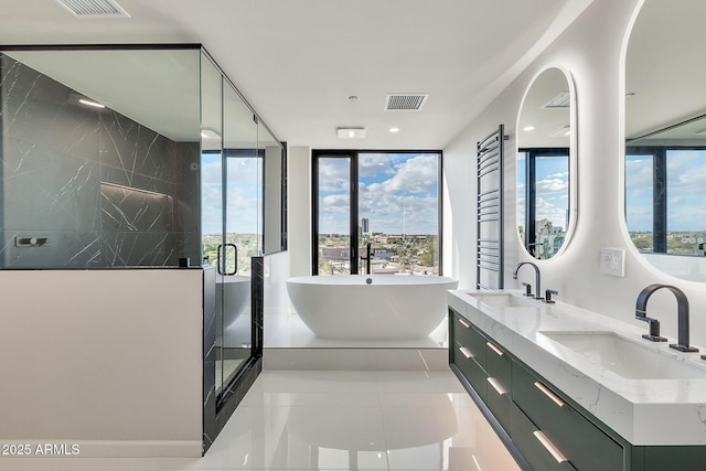 full bath featuring a soaking tub, visible vents, a sink, and a shower stall