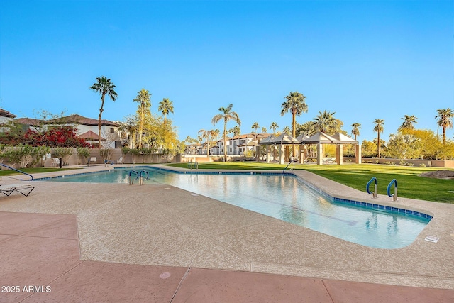 pool with a gazebo, a yard, and a patio area