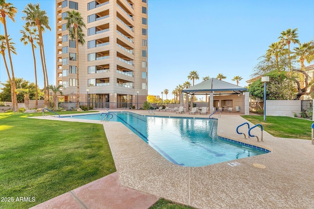 community pool with a gazebo, fence, a lawn, and a patio