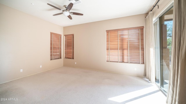 carpeted empty room with ceiling fan