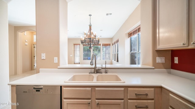 kitchen featuring kitchen peninsula, sink, light brown cabinets, an inviting chandelier, and dishwasher