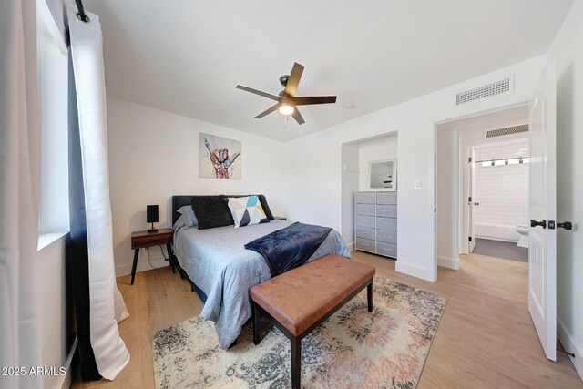 bedroom with visible vents, baseboards, a ceiling fan, and light wood-style floors