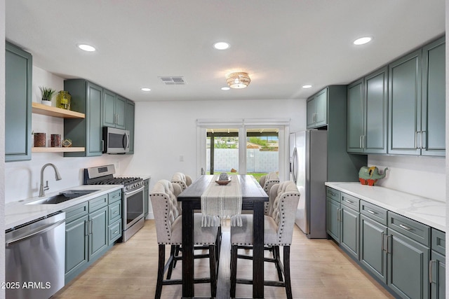 kitchen featuring recessed lighting, a sink, appliances with stainless steel finishes, and visible vents