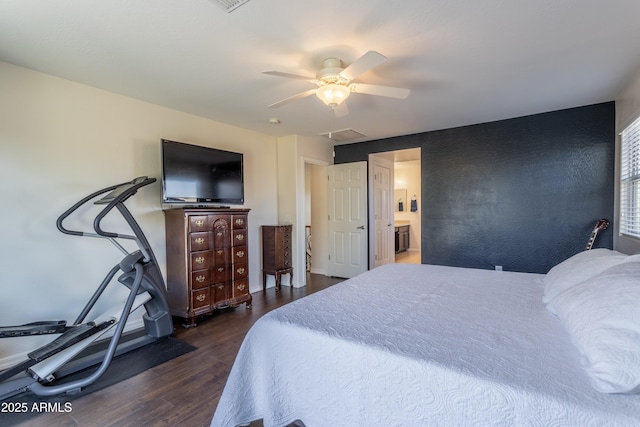 bedroom featuring a ceiling fan, dark wood-style floors, and visible vents