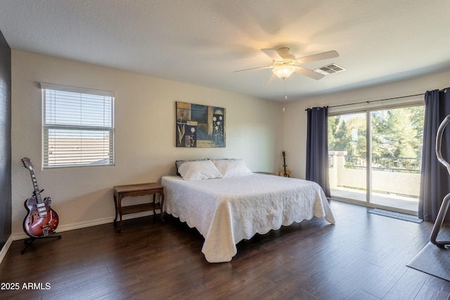 bedroom featuring dark wood finished floors, access to outside, baseboards, and visible vents