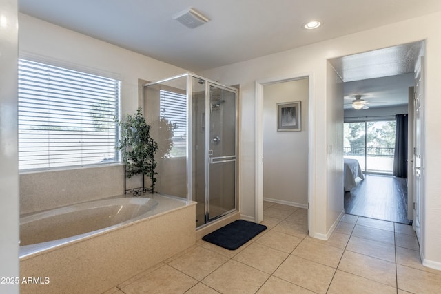 full bath featuring tile patterned floors, visible vents, a garden tub, and a stall shower