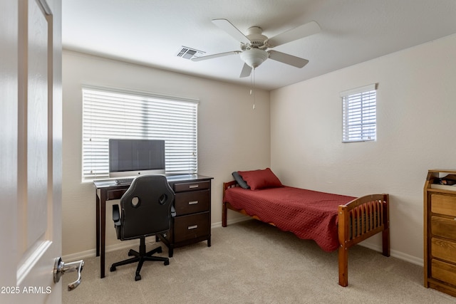 bedroom with light carpet, visible vents, and baseboards