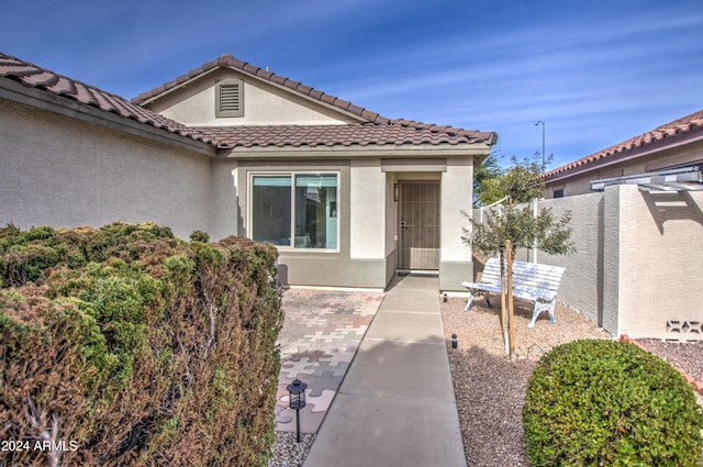 property entrance with a patio