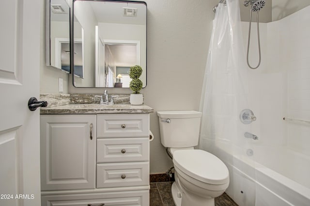 full bathroom with tile patterned floors, vanity, shower / bath combo, and toilet