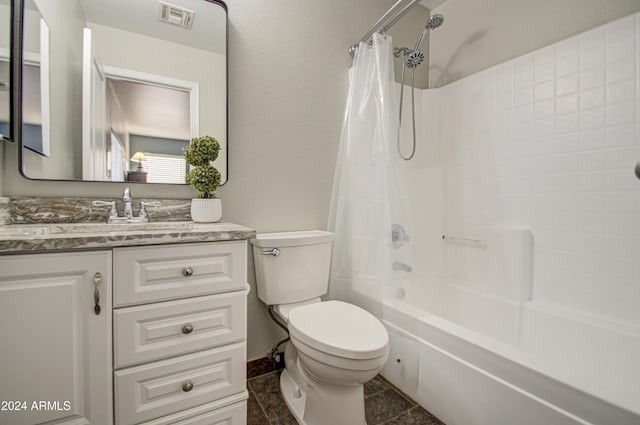 full bathroom featuring tile patterned floors, shower / bath combo with shower curtain, vanity, and toilet