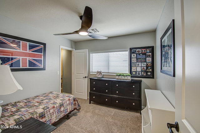 carpeted bedroom with ceiling fan