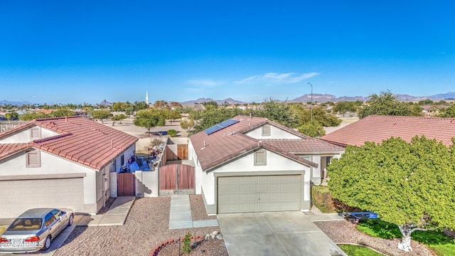 birds eye view of property featuring a mountain view