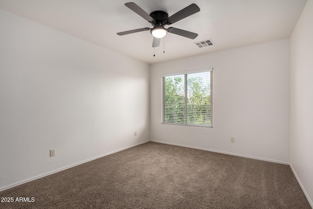unfurnished room featuring baseboards, ceiling fan, carpet flooring, and visible vents