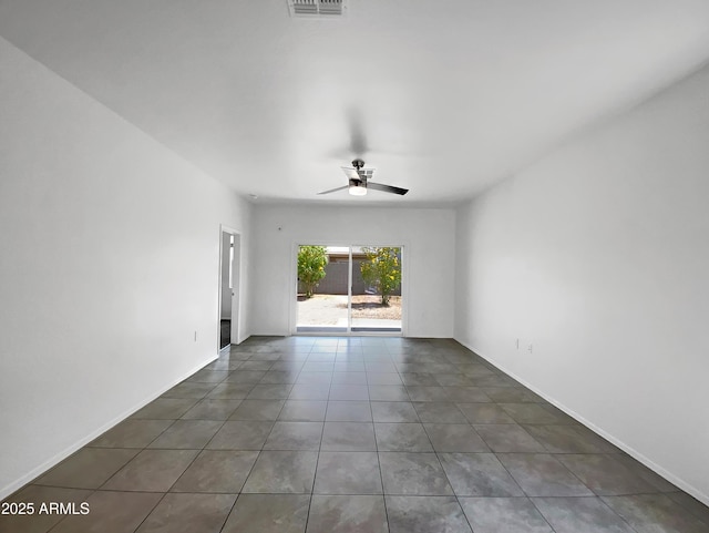 35337 W San Alvarez Ave, Maricopa, AZ 85138 - tiled spare room featuring a ceiling fan and baseboards