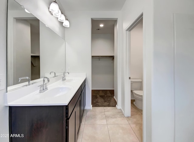 35337 W San Alvarez Ave, Maricopa, AZ 85138 - bathroom with toilet, tile patterned floors, double vanity, baseboards, and recessed lighting