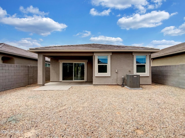 35337 W San Alvarez Ave, Maricopa, AZ 85138 - rear view of house featuring central AC unit, stucco siding, a fenced backyard, and a patio