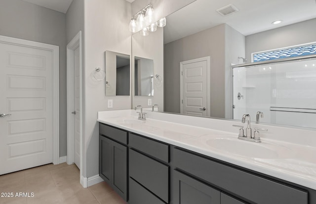 2851 N Coronado Dr, Florence, AZ 85132 - bathroom with a stall shower, visible vents, a sink, and tile patterned floors