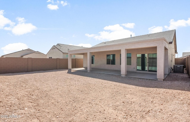 2851 N Coronado Dr, Florence, AZ 85132 - rear view of house with a fenced backyard, a patio, central AC, and stucco siding