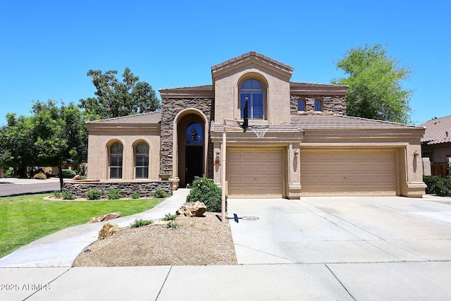 mediterranean / spanish-style home featuring stucco siding and a tiled roof