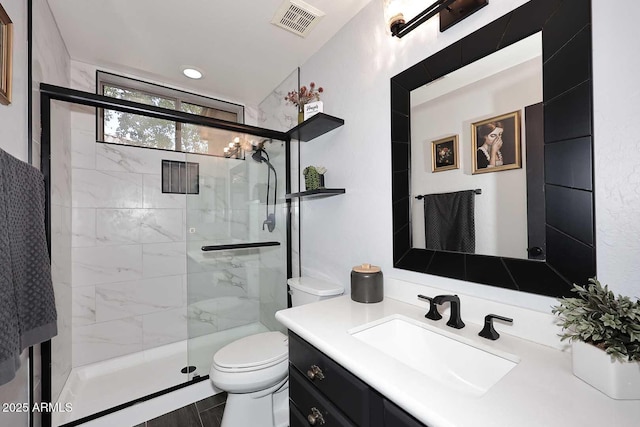 full bath with toilet, a shower stall, and vanity