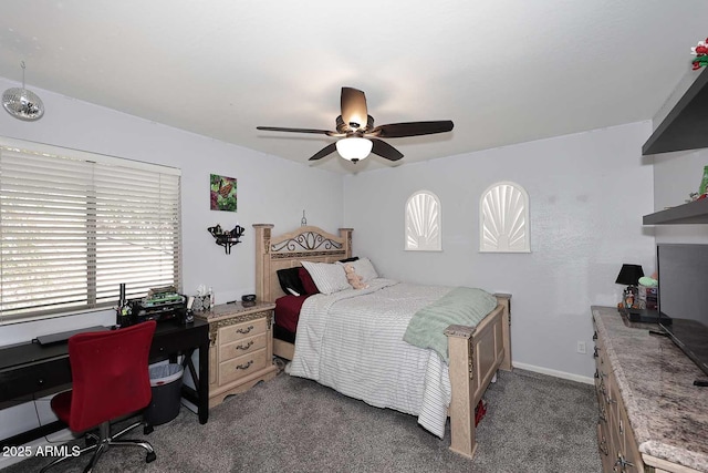 carpeted bedroom featuring a desk and ceiling fan