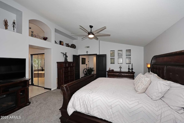 bedroom featuring light carpet, vaulted ceiling, and ceiling fan