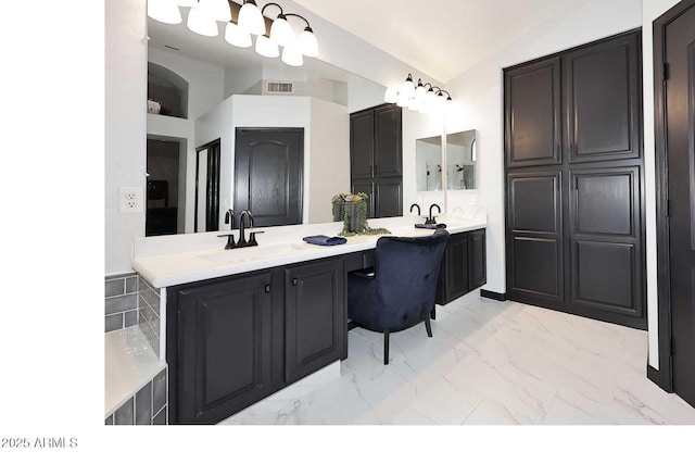full bathroom featuring lofted ceiling, marble look tile flooring, and double vanity