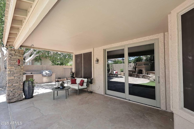 view of patio featuring fence