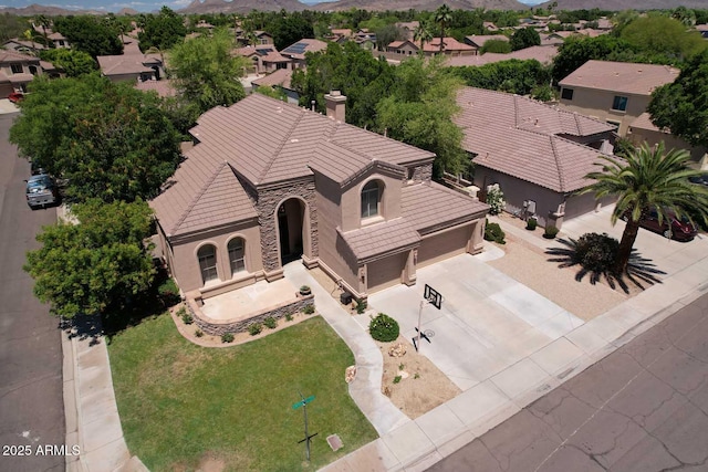 aerial perspective of suburban area featuring a mountain backdrop