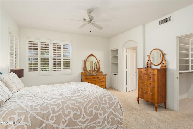 bedroom featuring light carpet and ceiling fan