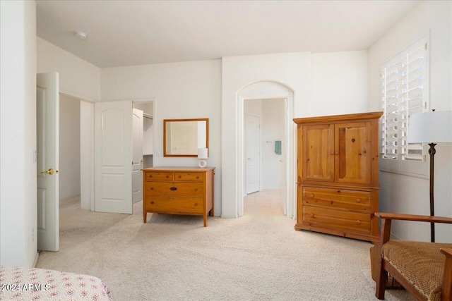 bedroom with light colored carpet